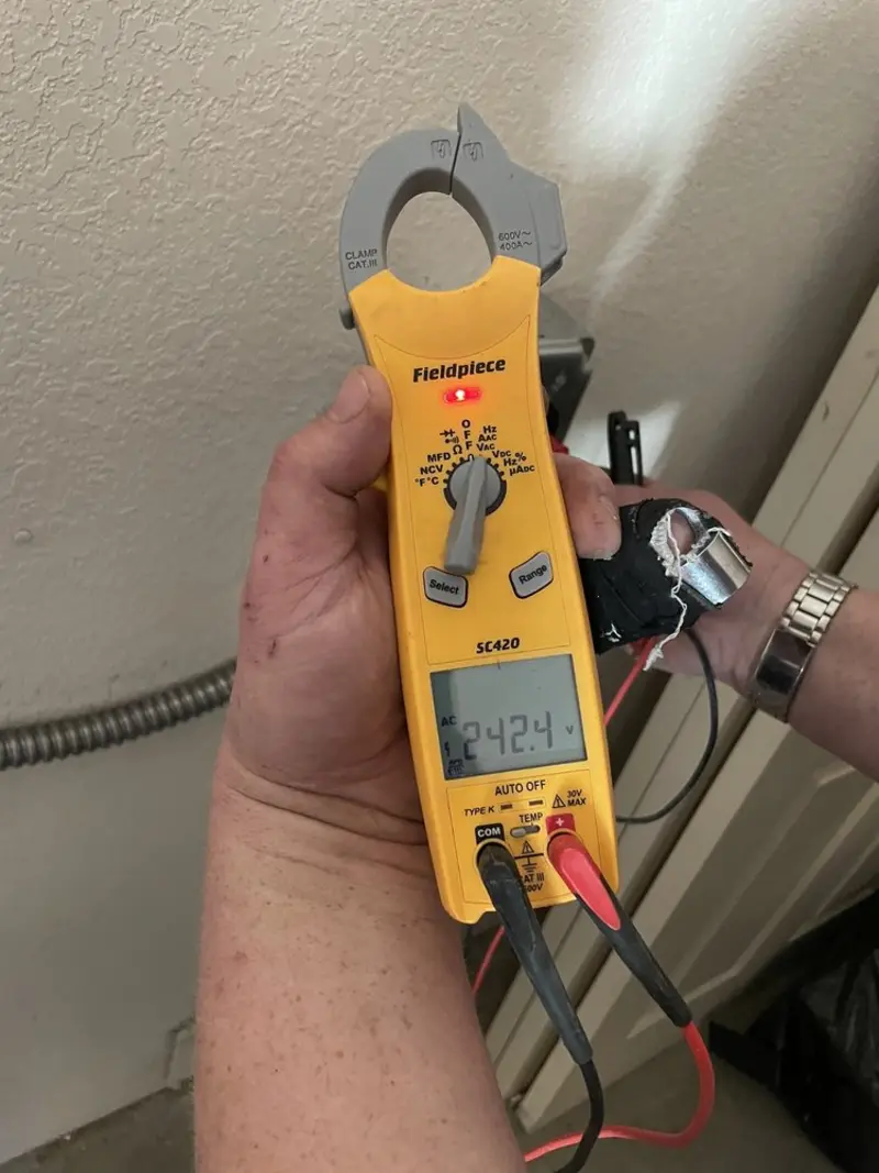 Voltage testing with clamp meter during Outlet Installation in Ward